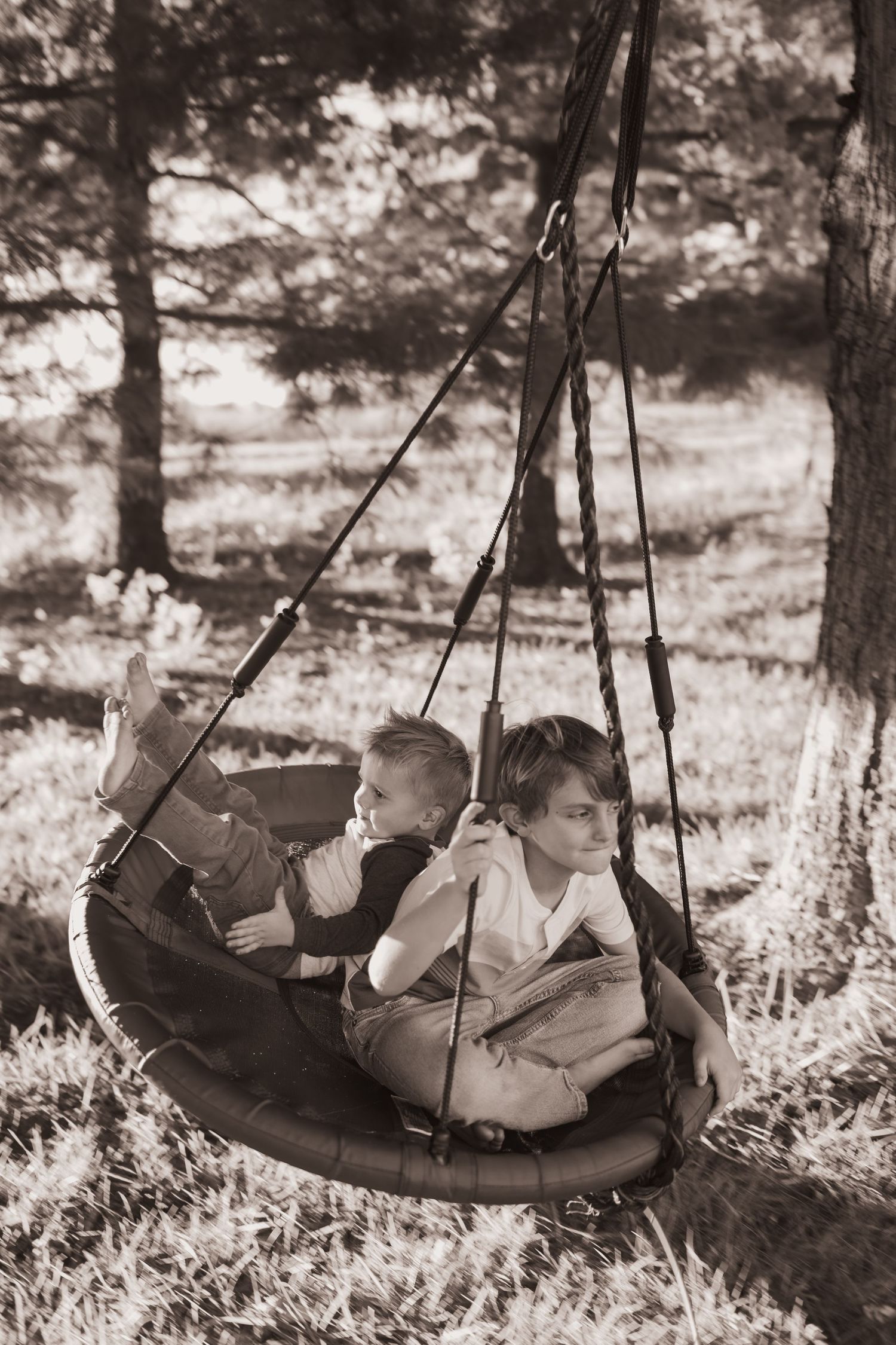 Kids playing in their front yard during a lifestyle shoot at their home near Middletown, OH. Photographed by Vicci Photo of Dayton, OH