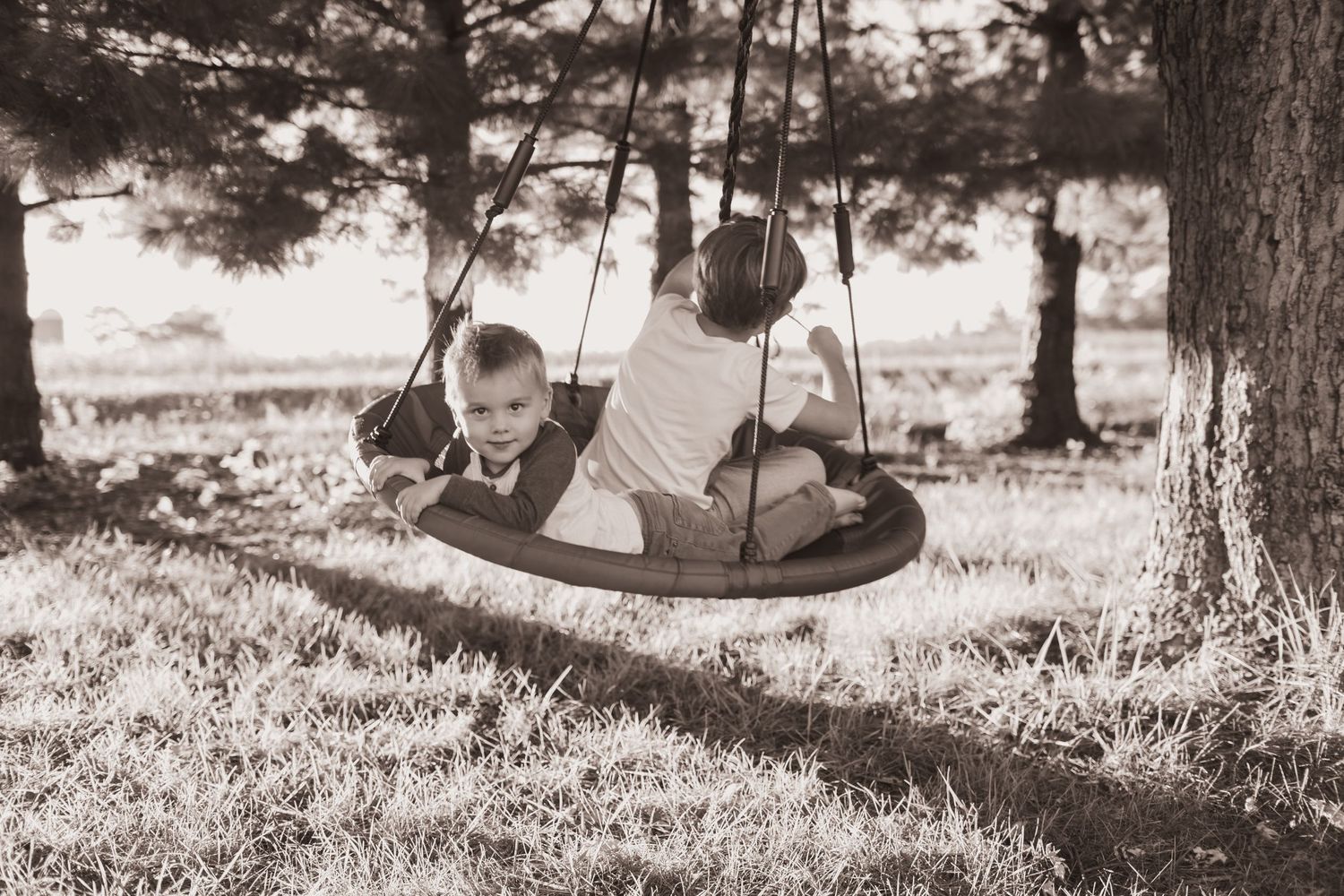 Kids playing in their front yard during a lifestyle shoot at their home near Middletown, OH. Photographed by Vicci Photo of Dayton, OH