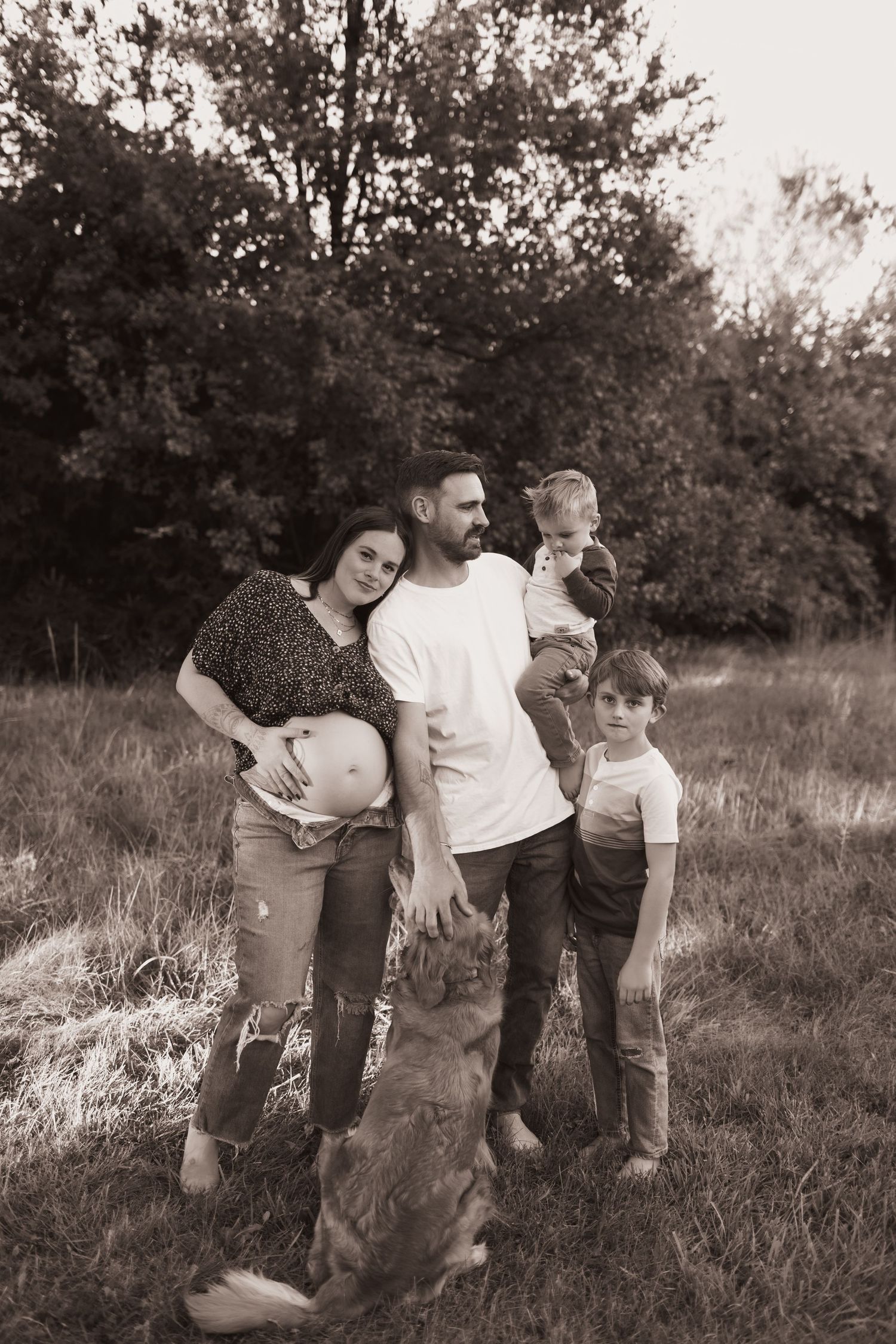 Family portrait, hugging for maternity pics with their dog at their home near Middletown, OH - Photographed by Vicci Photo of Dayton, OH
