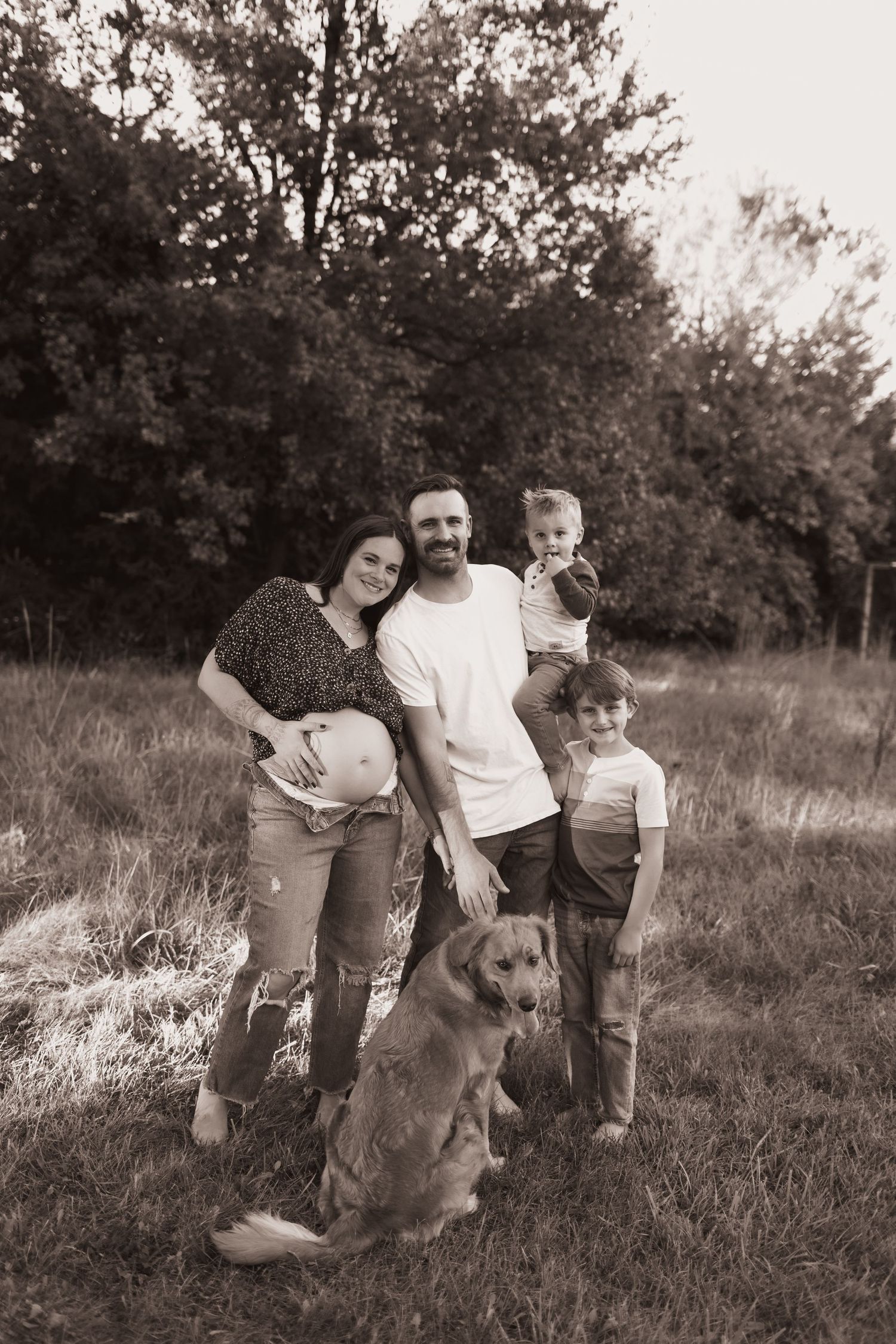 Family portrait, hugging for maternity pics with their dog at their home near Middletown, OH - Photographed by Vicci Photo of Dayton, OH