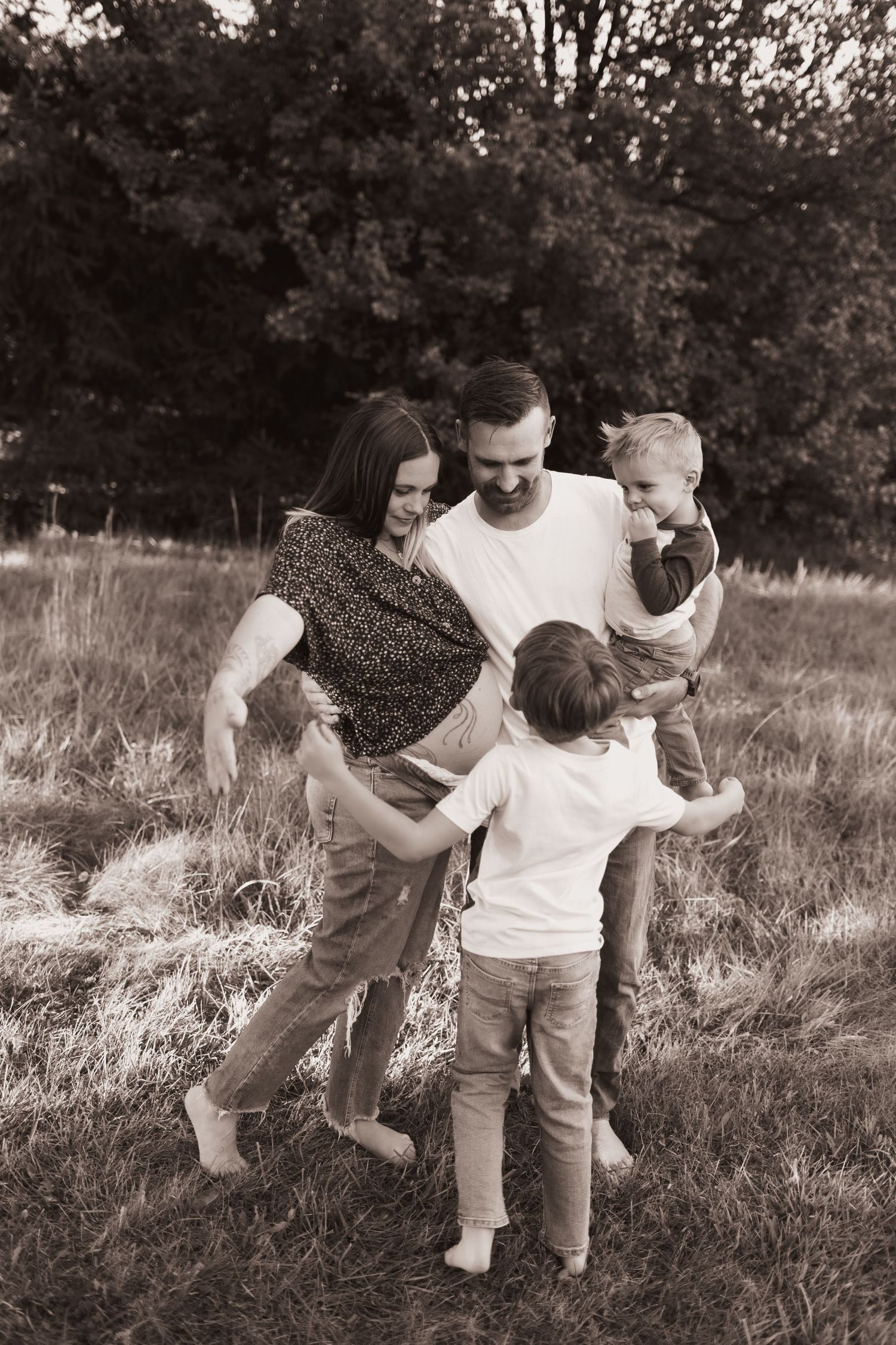 Family portrait, hugging for maternity pics at their home near Middletown, OH - Photographed by Vicci Photo of Dayton, OH