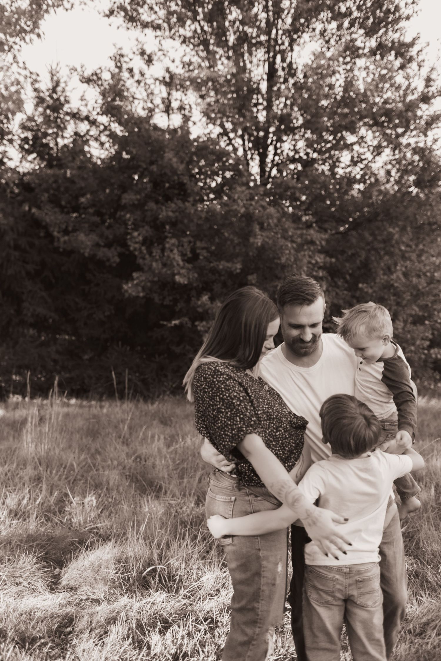 Family portrait, hugging for maternity pics at their home near Middletown, OH - Photographed by Vicci Photo of Dayton, OH