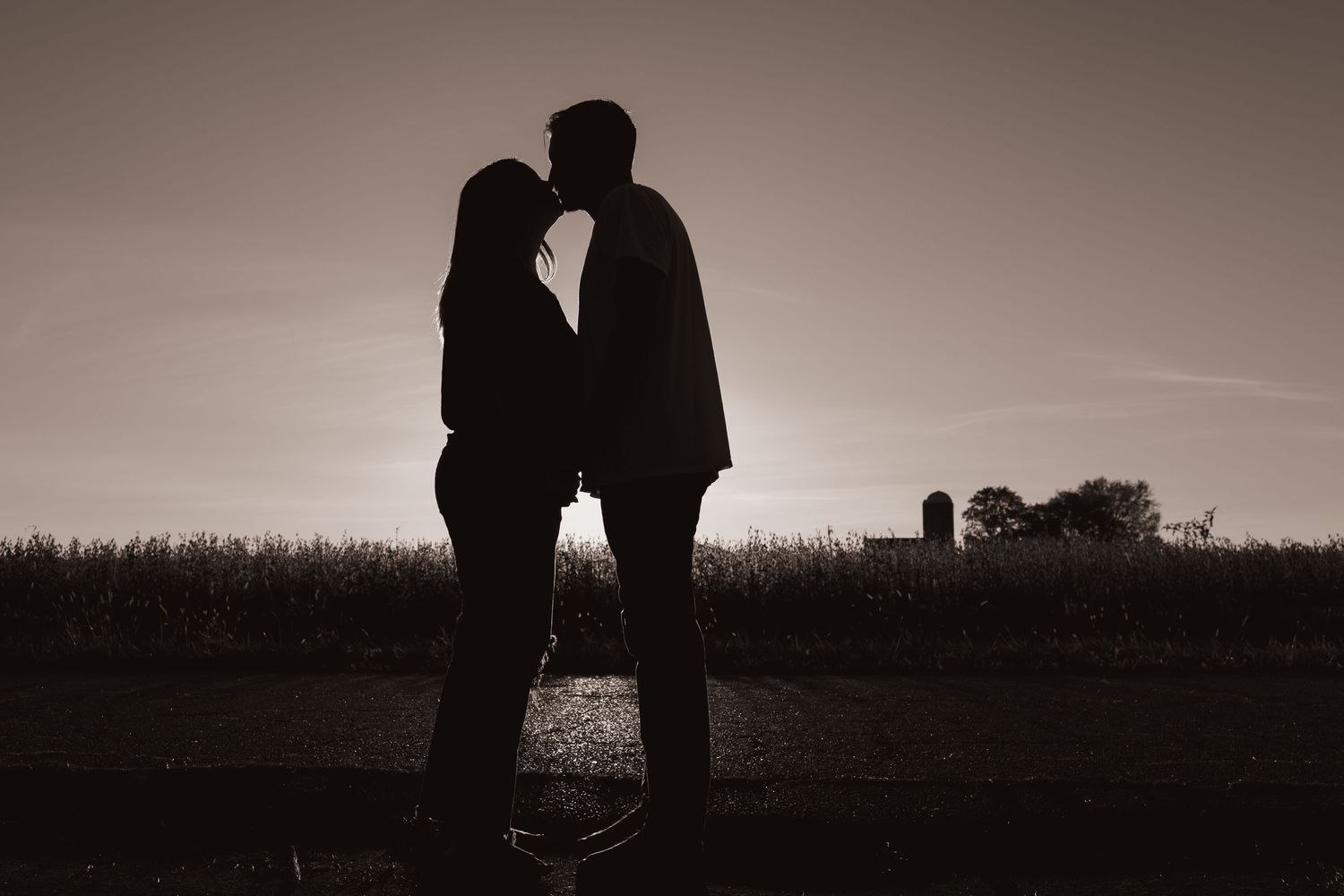 Silhouette against the sunset of a couple at their home near Middletown, OH - Photographed by Vicci Photo of Dayton, OH