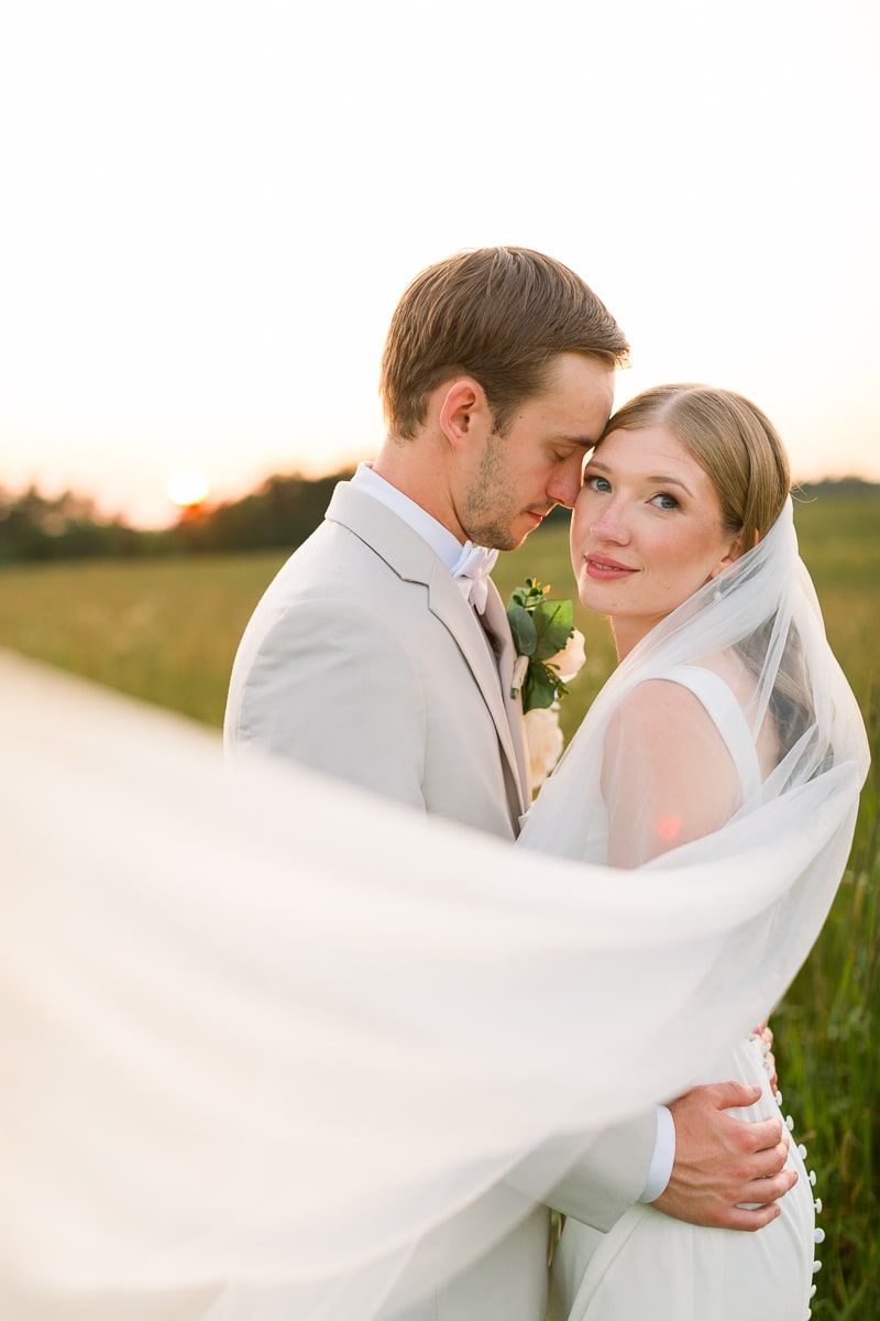 Nate and Jenna touch foreheads as Jenna's veil blows in the wind