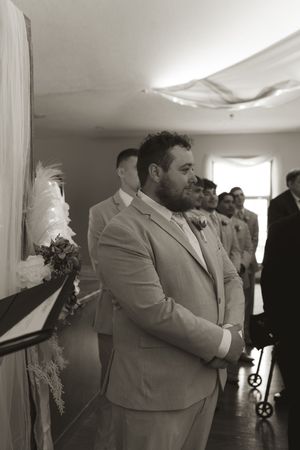 Black and white photos show a couple dancing together at a wedding reception in formal attire.