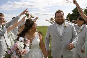 Candid celebration shots of wedding party in gray and mint green attire outdoors.