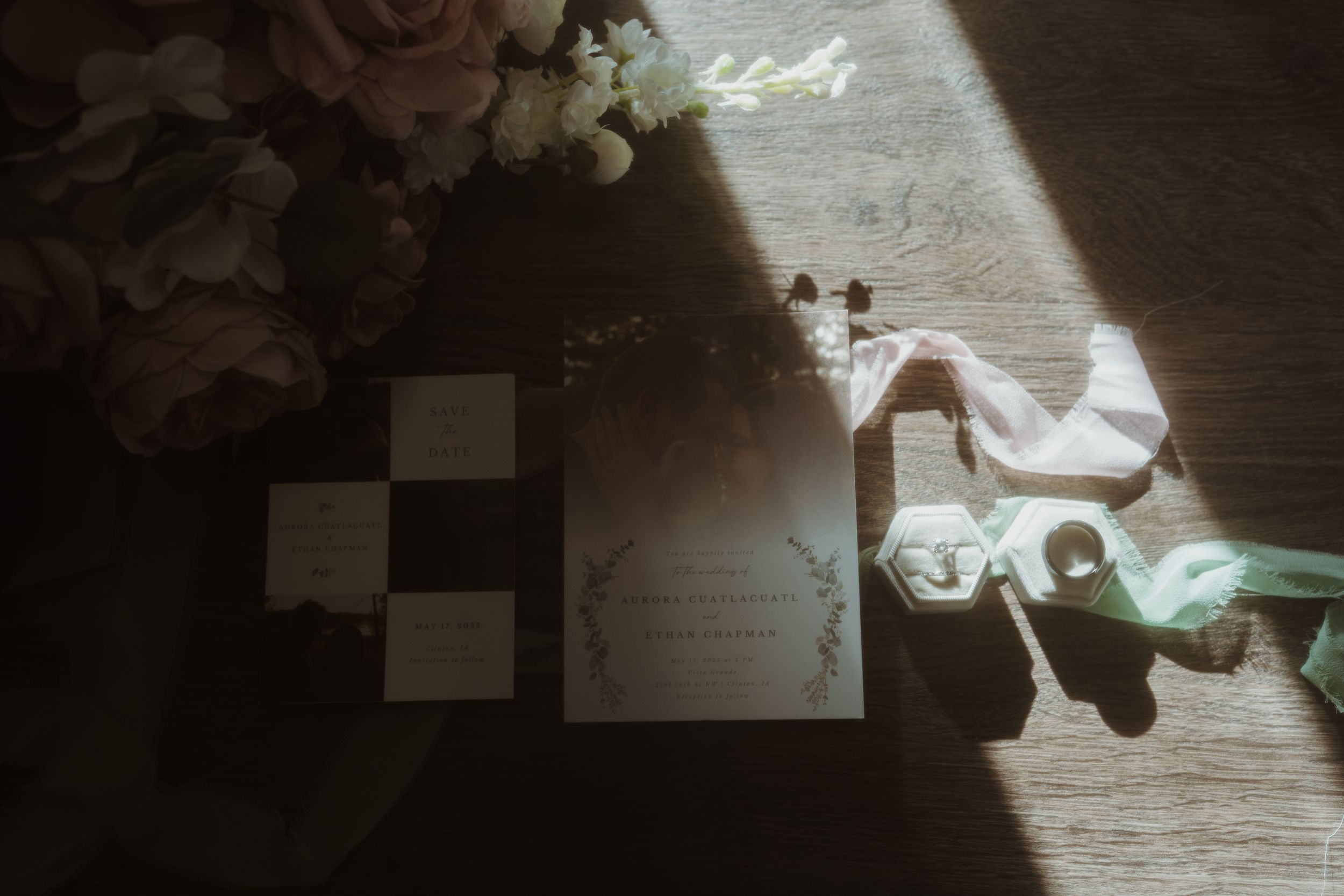 Artistic dark and moody wedding reception detail shot with bokeh lighting effects.