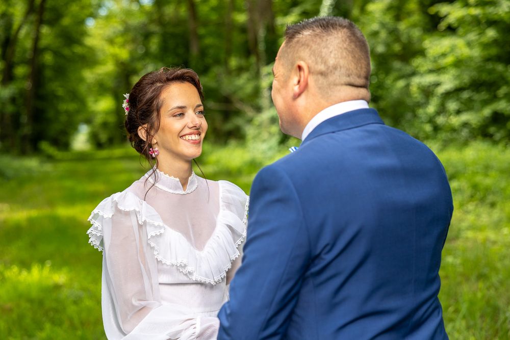 Wedding couple sharing intimate moments in a beautiful spring garden setting.