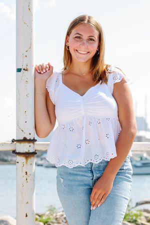 Summer fashion portraits by marina featuring white eyelet top and light denim.