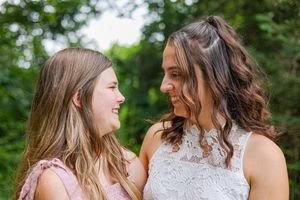 Close up portrait series showing affectionate moments in soft lighting.