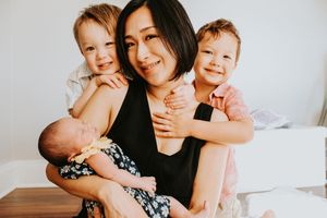Candid family portrait showing loving embraces and sweet moments together.