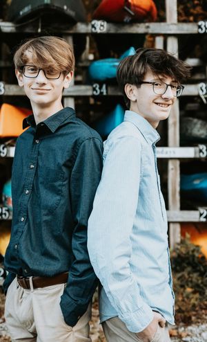 A series of candid outdoor shots showing two people standing close together wearing casual clothing.