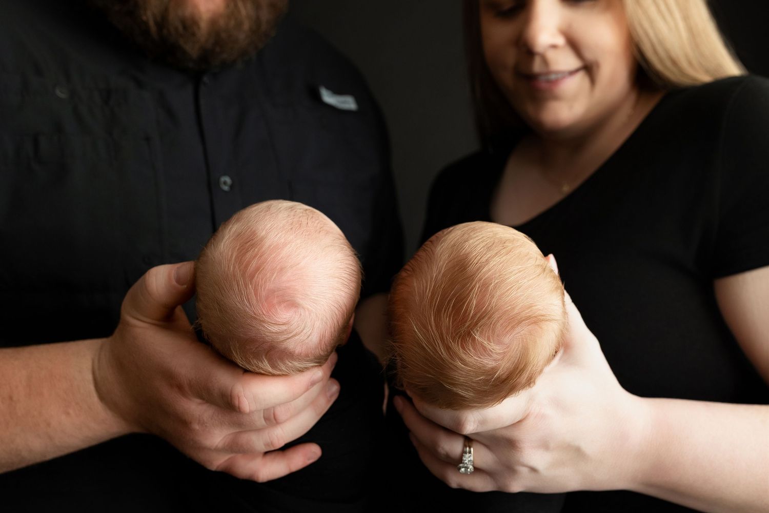 Mom and Dad are looking at the twins smiling. Greenville SC newborn photographer, Easley SC newborn photographer