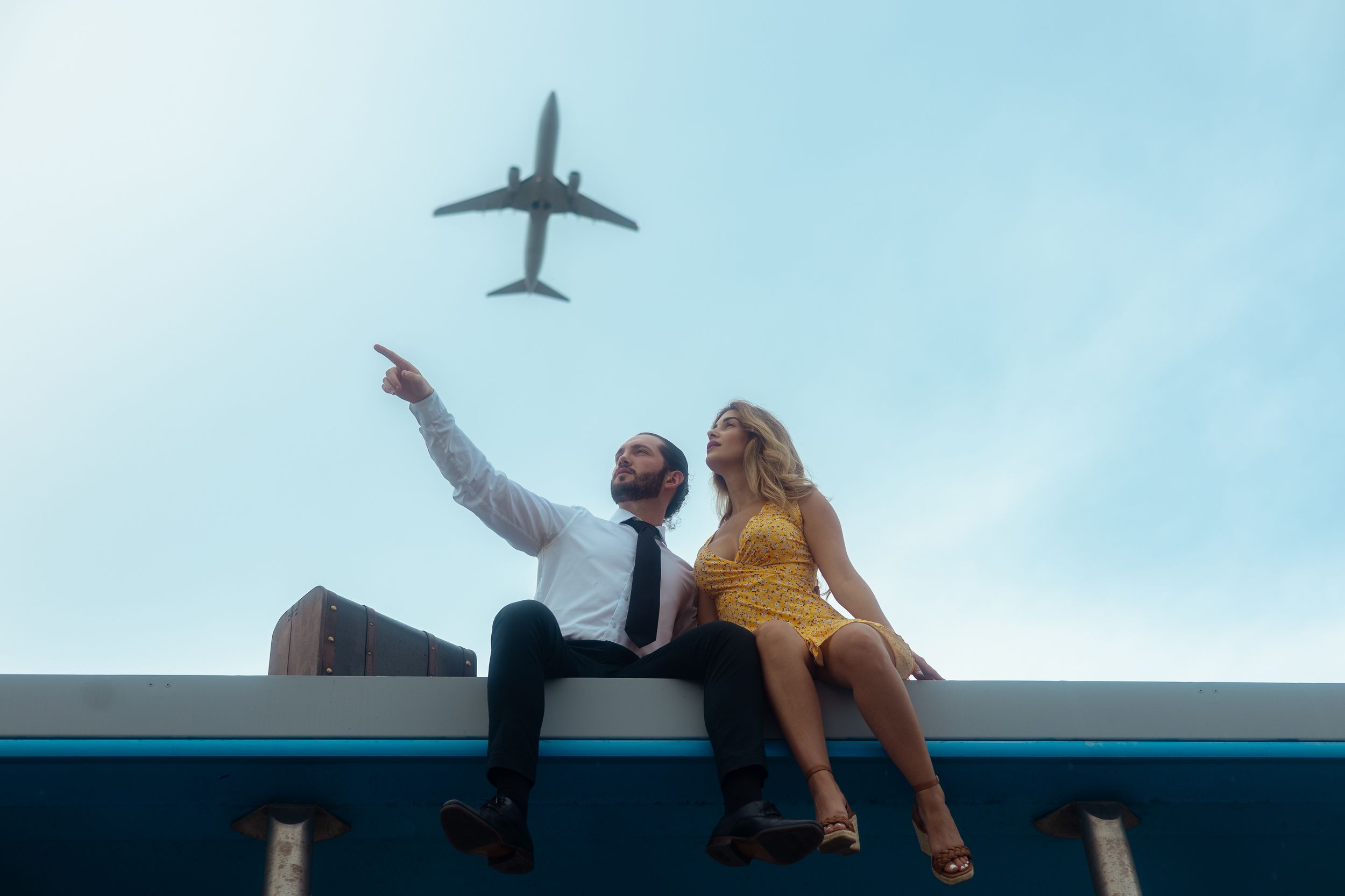 Cinematic Miami engagement session under airplane sky, romantic proposal photography perfect for Pinterest inspiration by MannyPortraits.