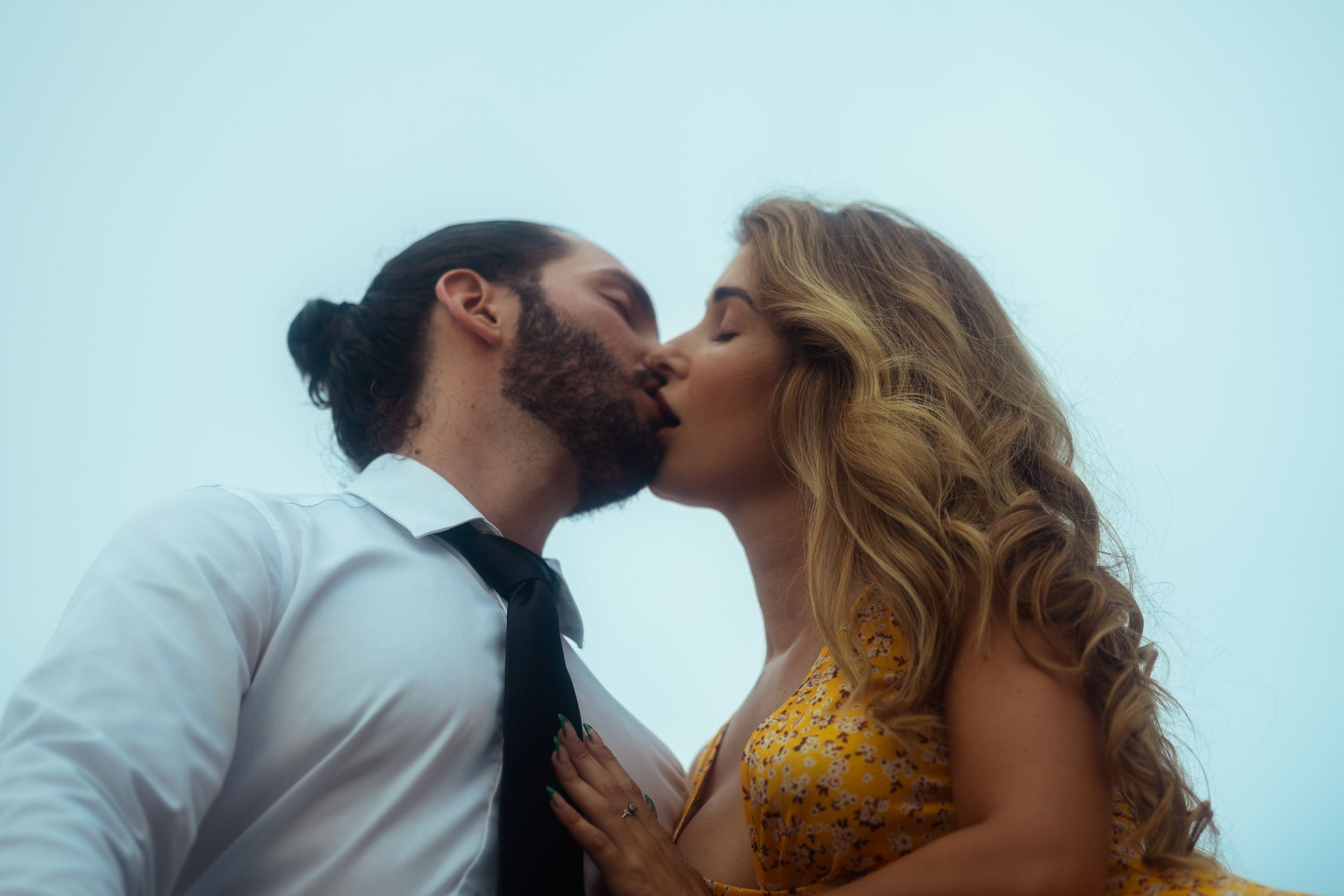 Romantic cinematic couple kiss, Miami engagement portrait styled for Pinterest weddings & Instagram love stories by MannyPortraits.