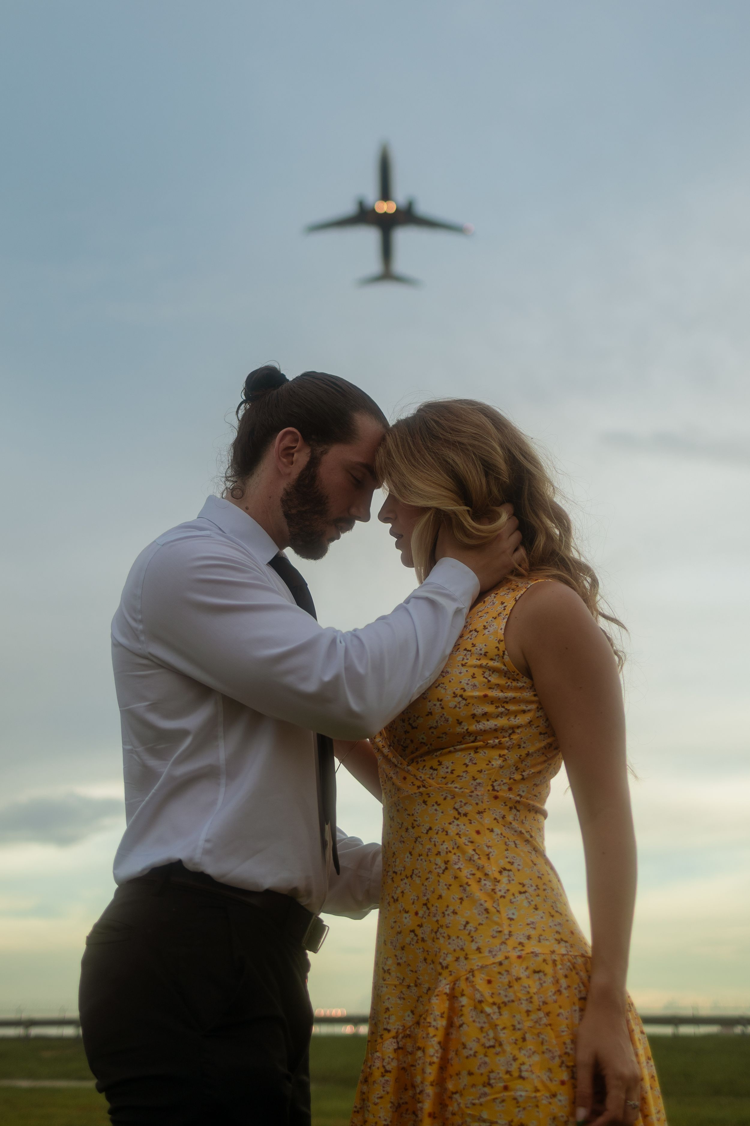 Cinematic Miami couple portrait with airplane overhead, romantic engagement session styled for Instagram by MannyPortraits