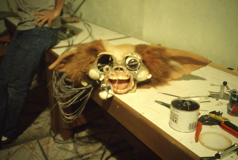 Behind the scenes Gremlins (1984), working on the oversized Gizmo puppet