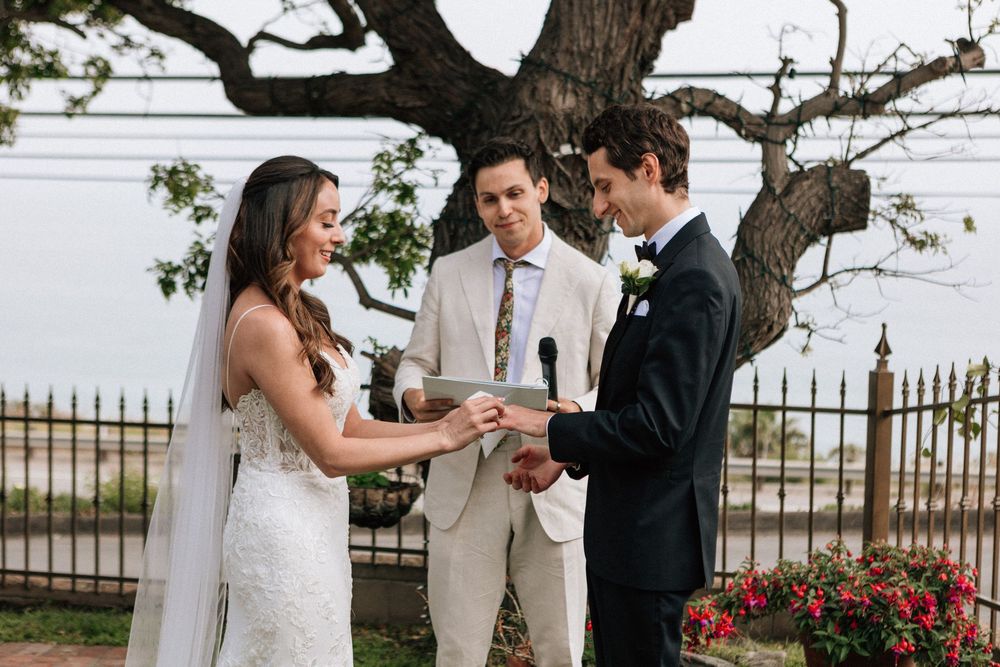 Malibu elopement ring exchange under a historic oak tree on PCH.