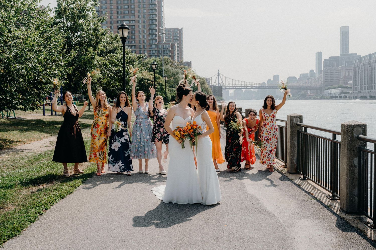 Wedding party walks along the waterfront at the Sanctuary Roosevelt Island NYC