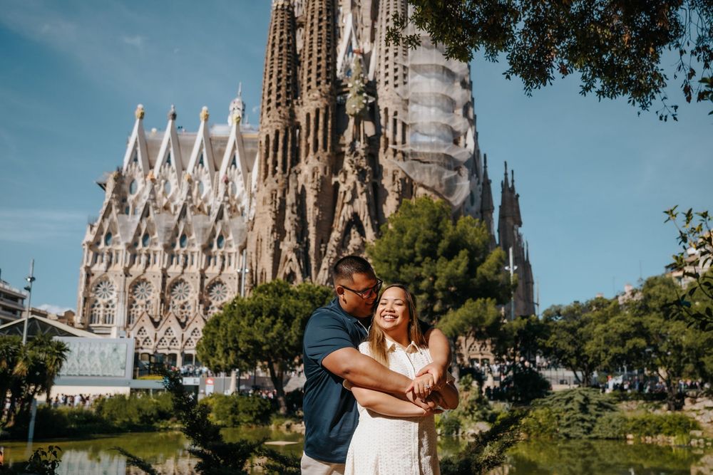 Seham & Cyrill smiling together during their honeymoon photoshoot in Sagrada Familia, Barcelona.