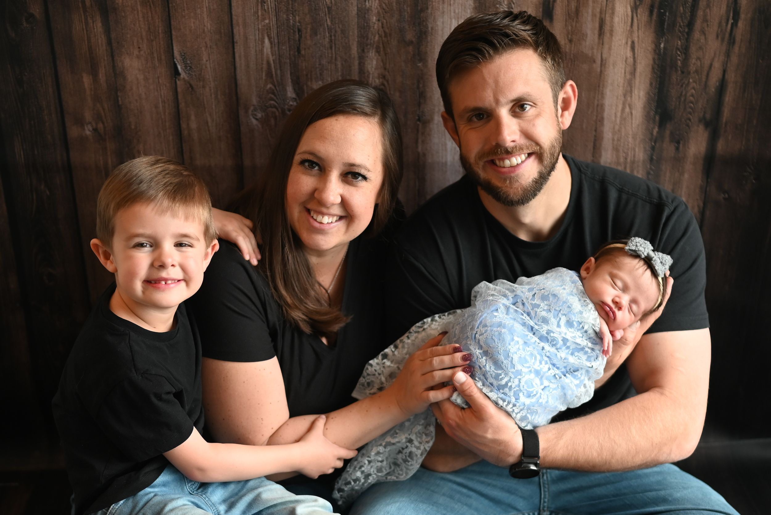 A collection of heartwarming black and white family photos showing intimate moments of togetherness and smiles.
