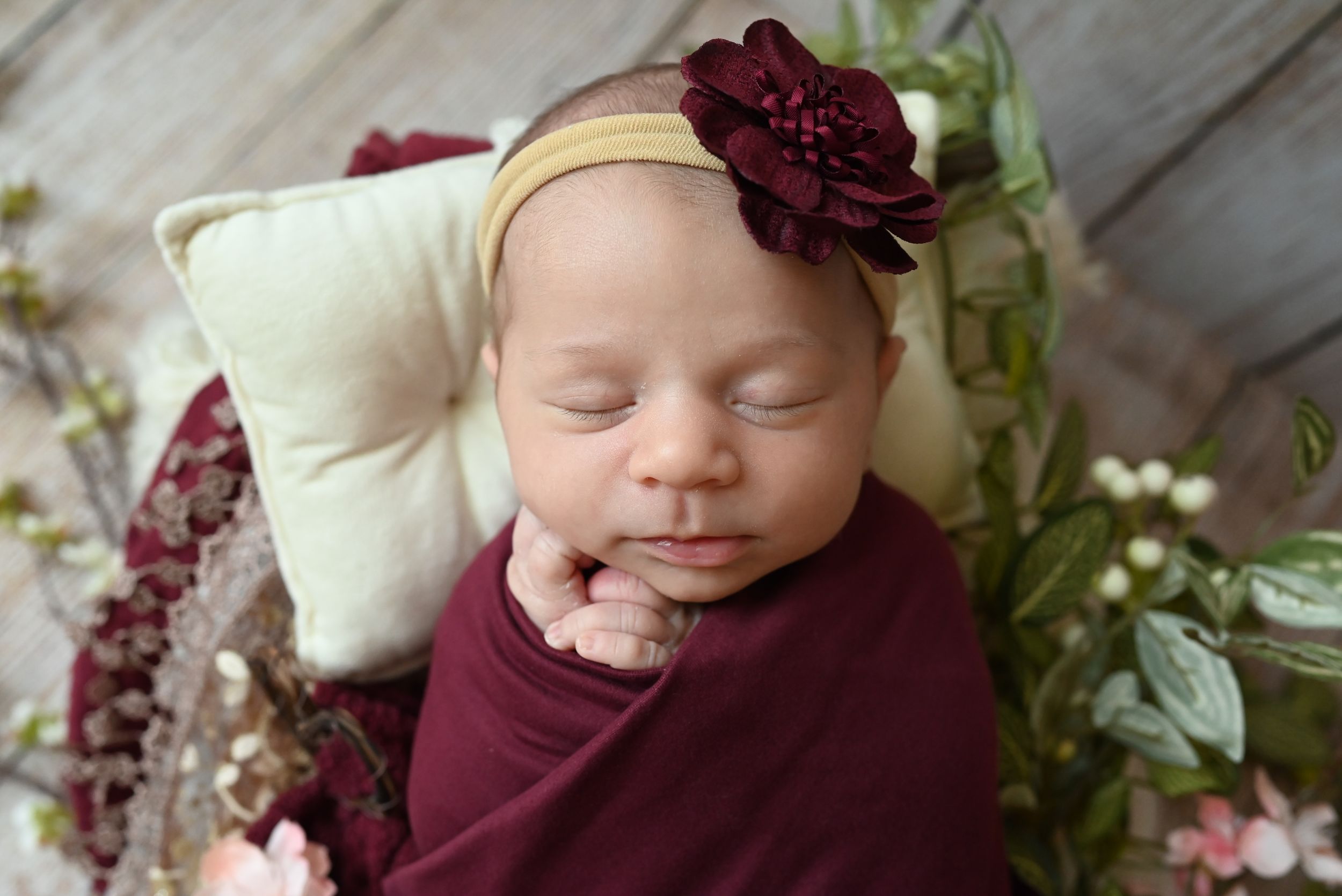 Collection of candid photographs showing a young subject in burgundy against greenery and floral backgrounds.