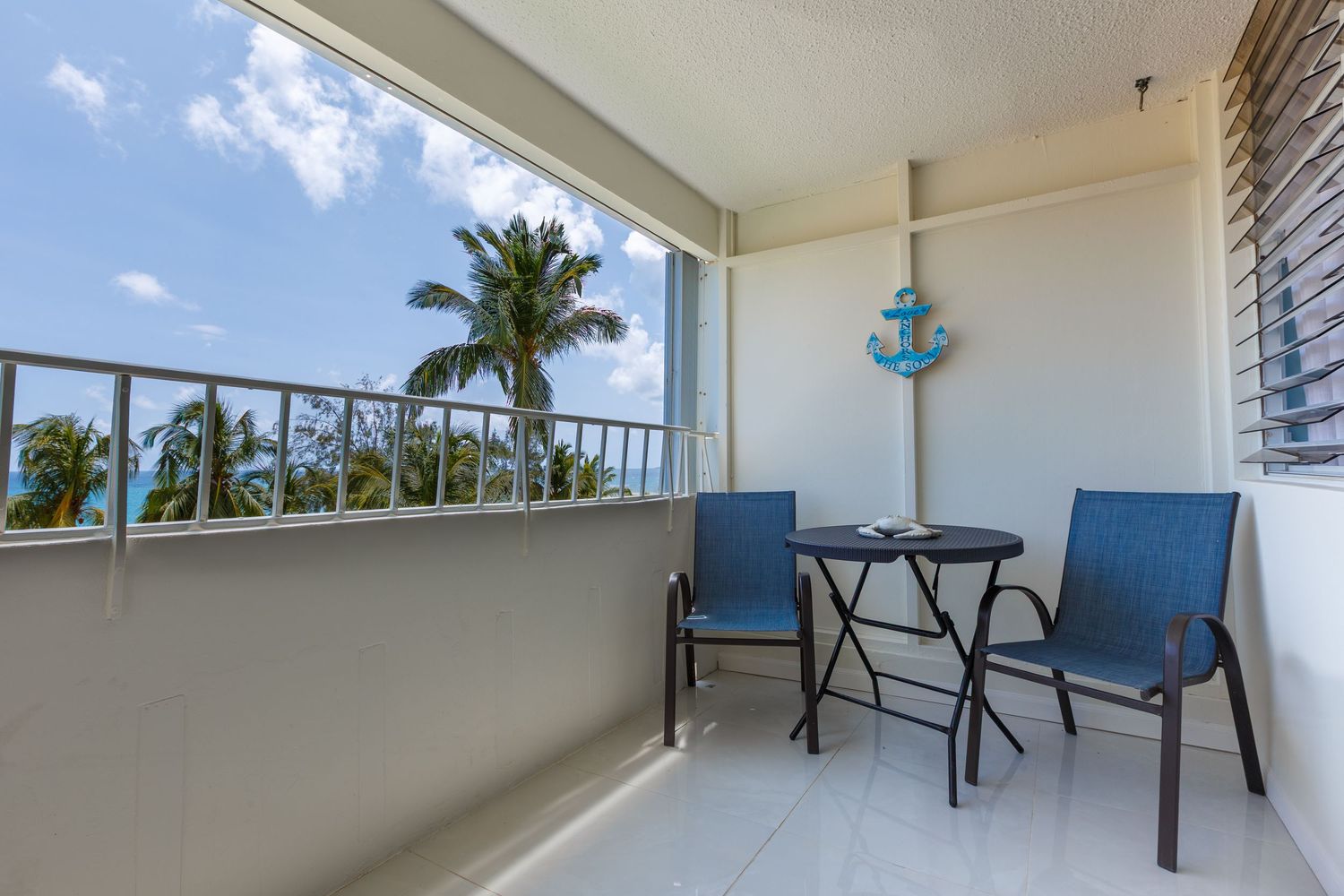 Real estate photography. Balcony and view. Short-term rental in Playa Azul Tower 1 in Luquillo, Puerto Rico.