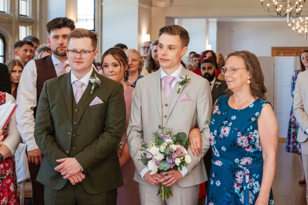 Coombe Lodge Somerset Wedding Photographer Zara Davis Photography two grooms and mum at the alter music room LGBT