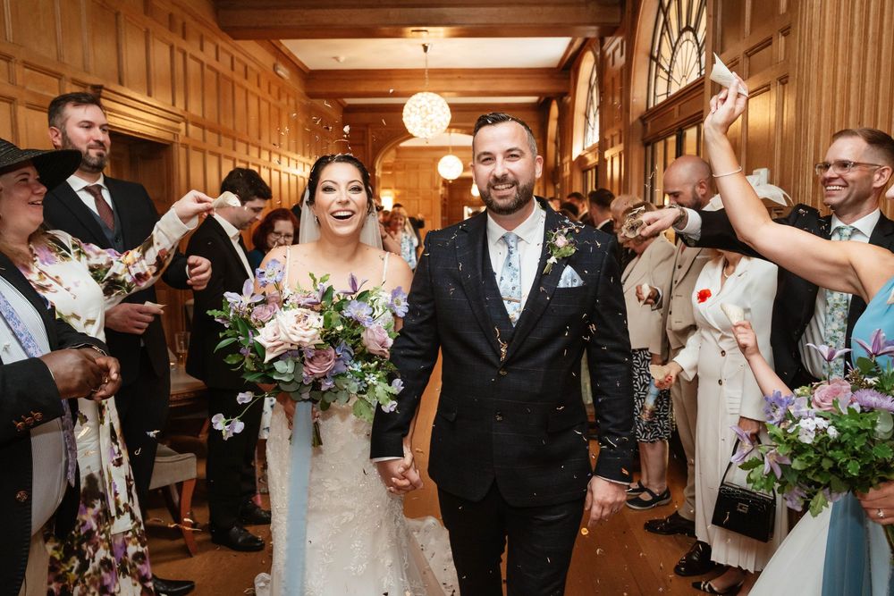 Coombe Lodge Somerset Wedding Photographer Zara Davis Photography bride and groom confetti indoors in the gallery
