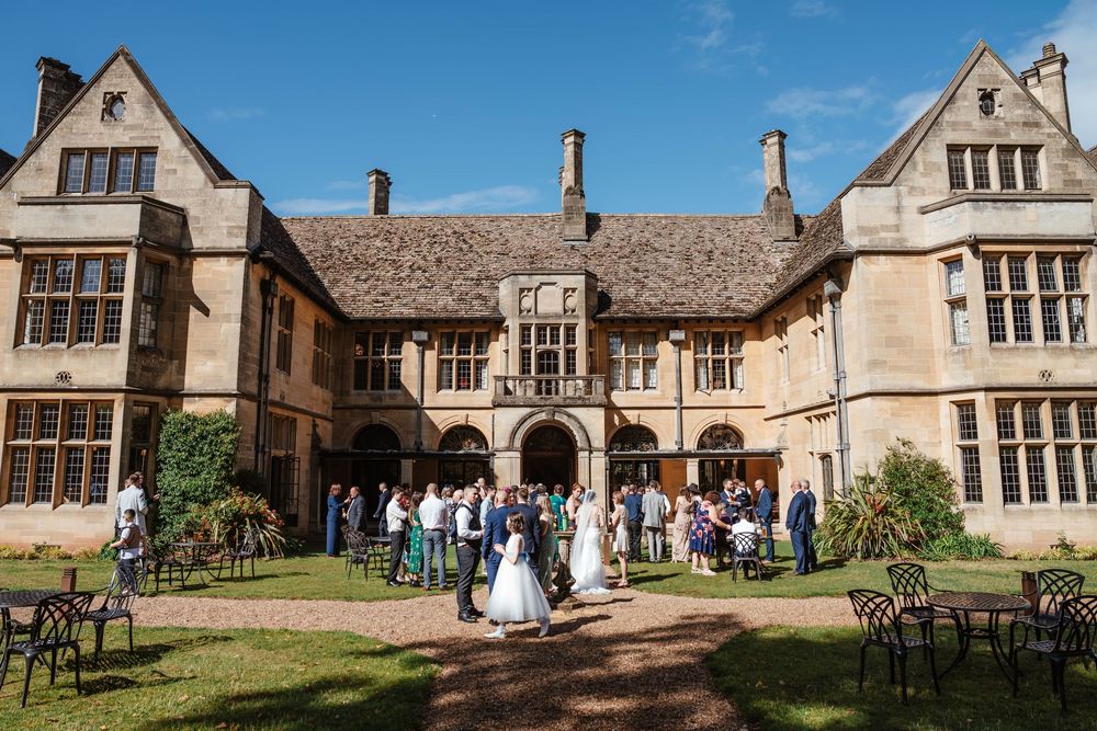 Coombe Lodge Somerset Wedding Photographer Zara Davis Photography back of venue during drinks reception guests mingling