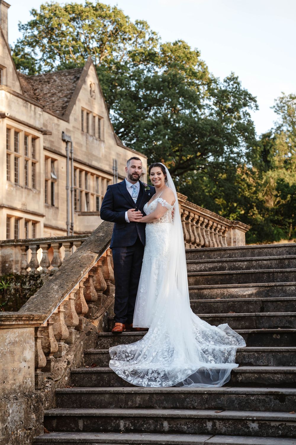 Coombe Lodge Somerset Wedding Photographer Zara Davis Photography bride and groom posed on steps
