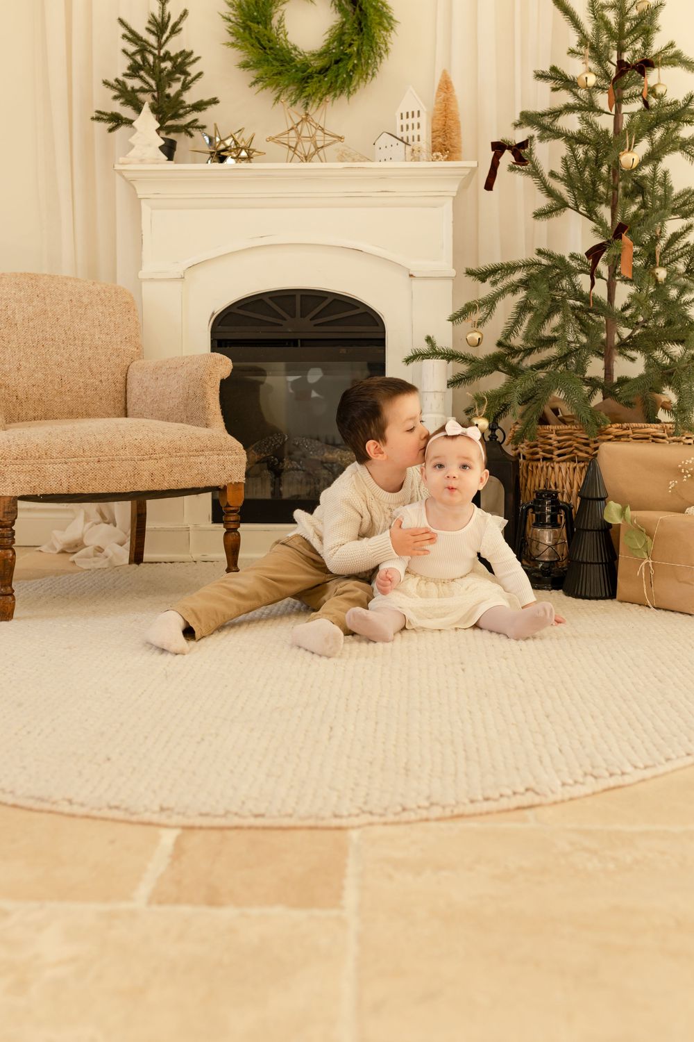 A series of holiday-themed photographs showing a cozy living room with Christmas trees, wreaths, and people on a cream carpet.