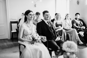 Black and white wedding celebration candids showing joyful moments between guests during the reception party celebration.
