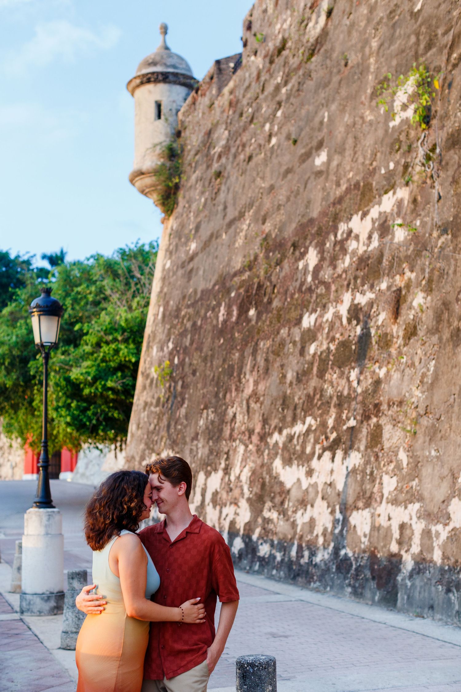 Surprise marriage proposal in Old San Juan, Puerto Rico. Paseo de la Princesa. Man and woman.