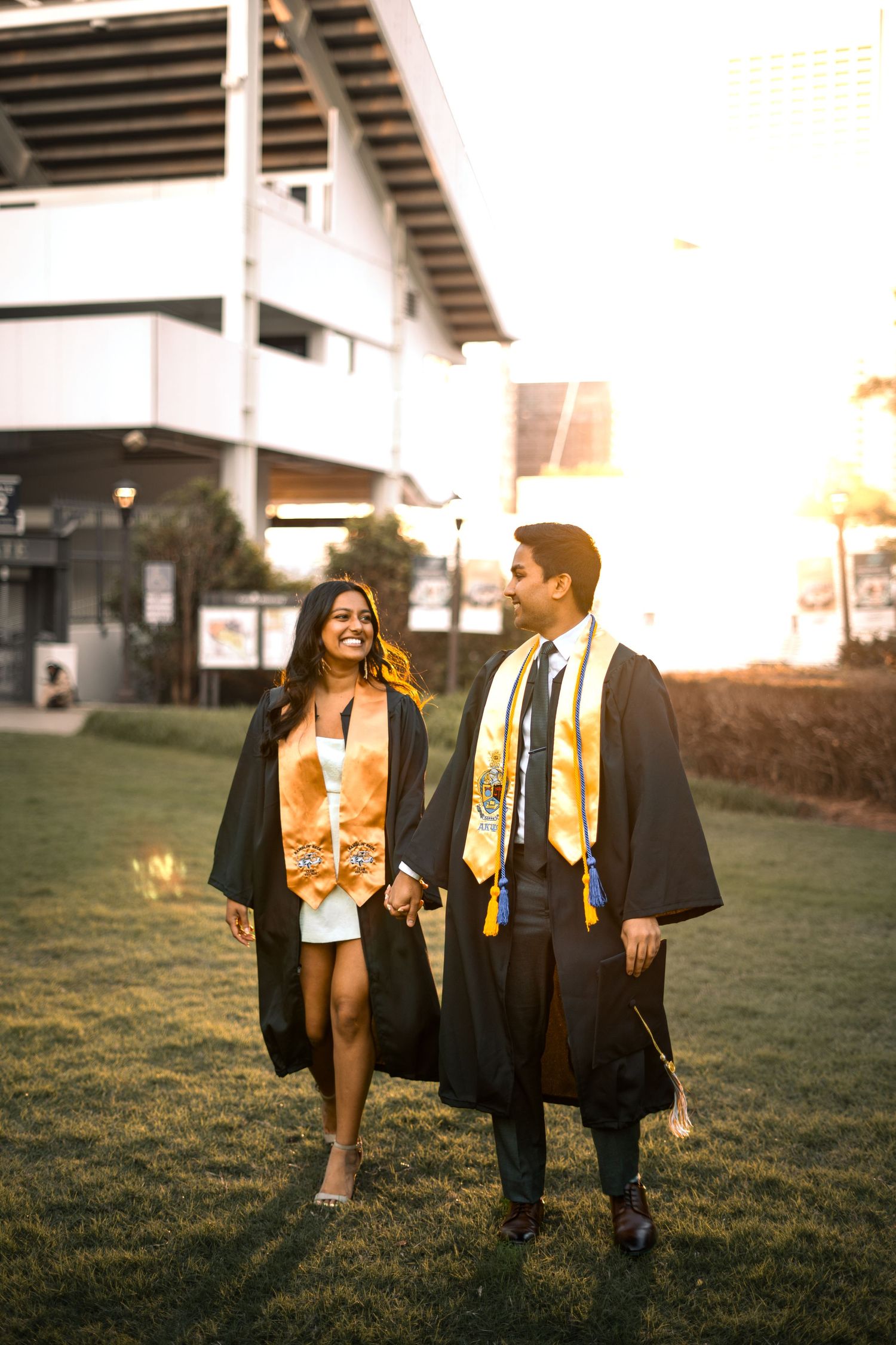 Smiling graduate poses for the best Atlanta grad photos at Georgia Tech with portraits by Pierre The Pear Photography