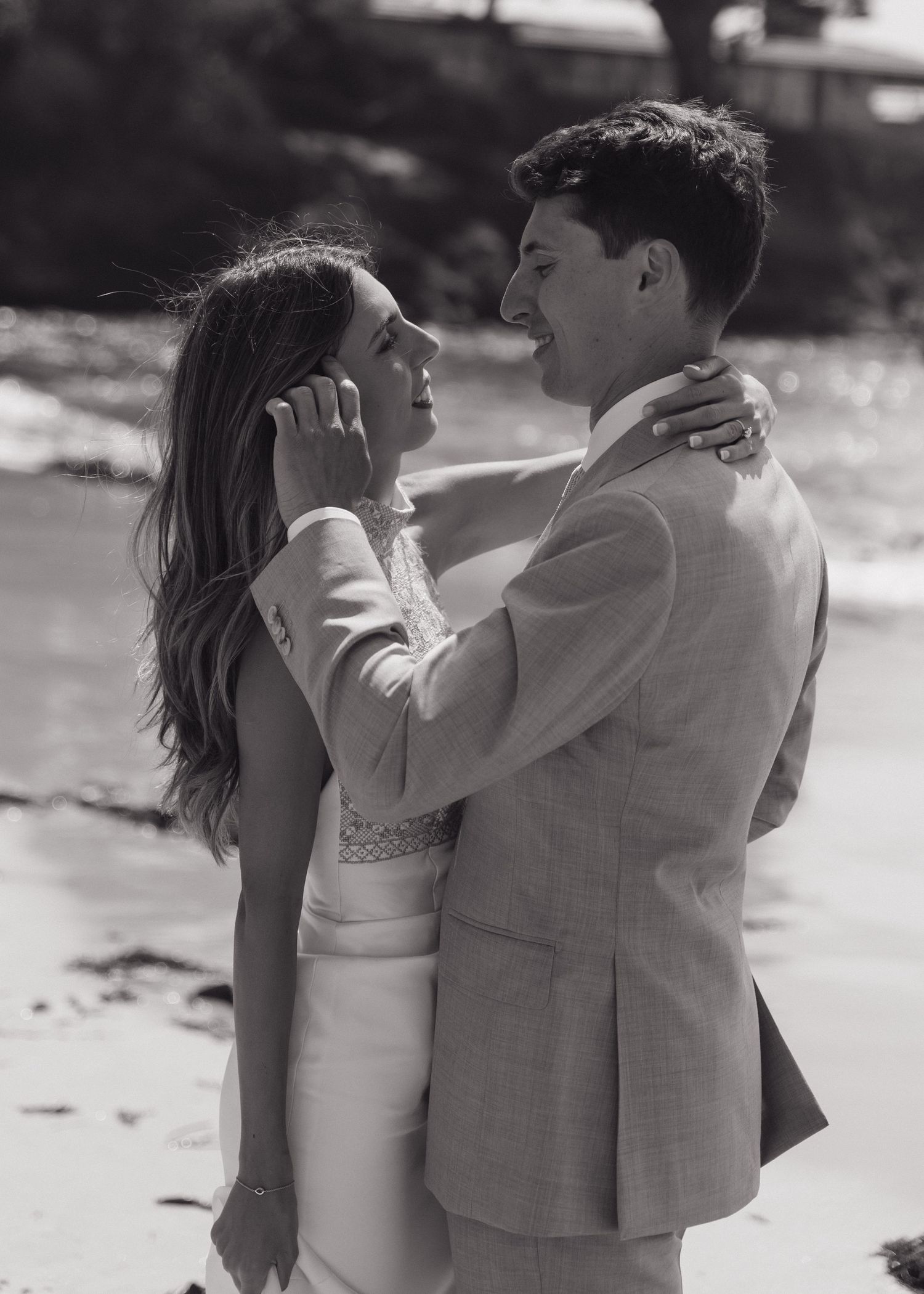 Black and white portrait of newly married couple at the beach in Carmel, California.