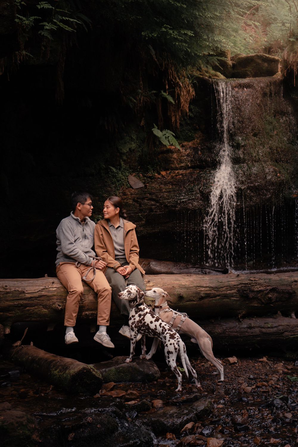 Adventure couples photoshoot beneath a waterfall near Falkland, Fife, Scotland.