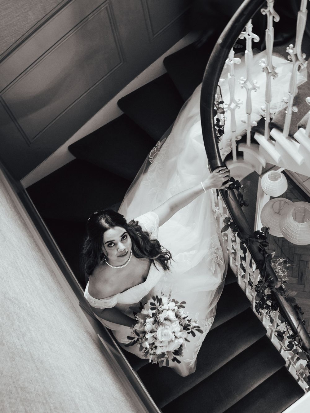 Natural wedding photo of bride walking down stairs in Dundee, Scotland. by kinross wedding photographer