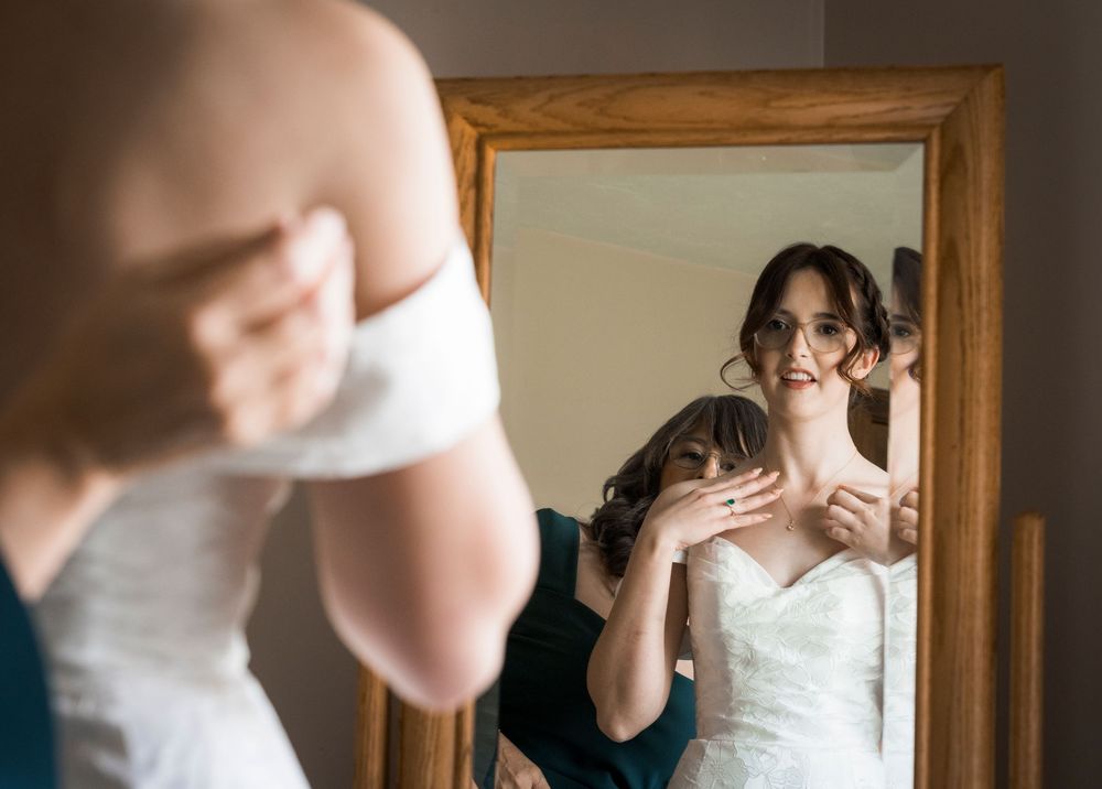 Romantic wedding moments captured in a series of intimate indoor portraits with warm lighting and wooden frames.