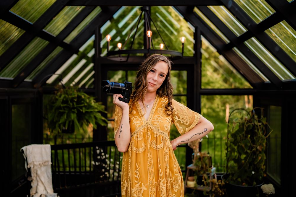 A sequence of fashion poses inside a glass-roofed structure featuring a golden yellow dress.