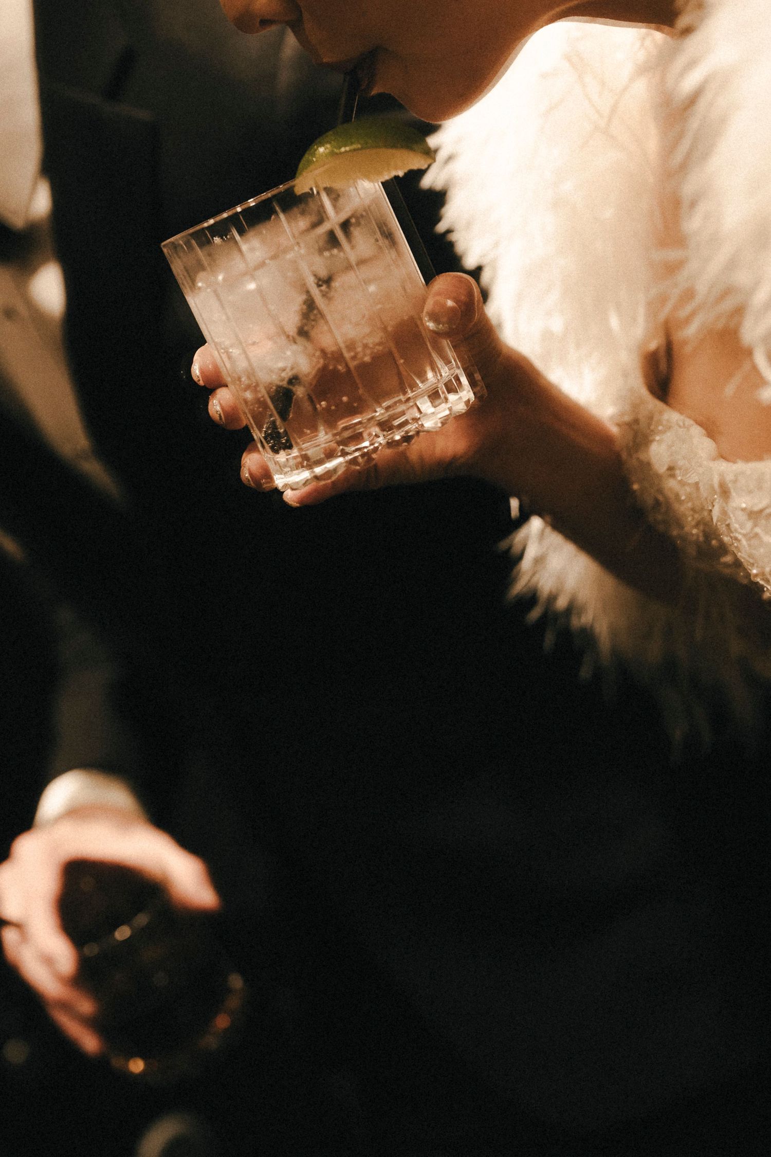 Artistic black and white photo sequence of a couple embracing under modern architecture.