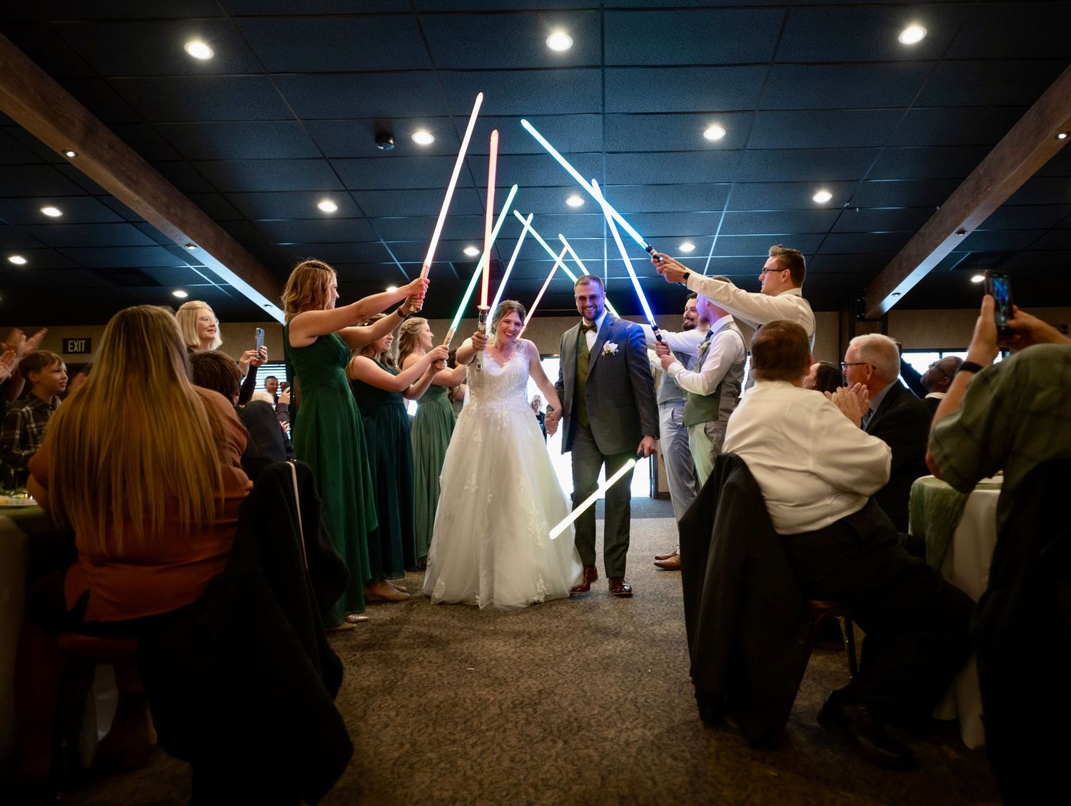 A large Star Wars themed church wedding in the foothills at Miwuk, California, where the bridal party all brandished light sabers!