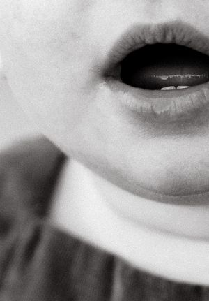 Black and white extreme close-up series of lips and facial features.