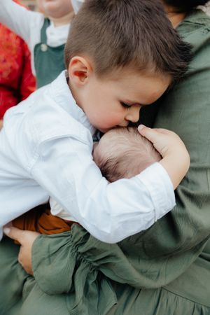 Close-up sequence showing a tender moment of comfort and embrace between two people.