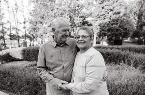 Candid outdoor portrait series showing an elderly couple sharing joyful moments together.