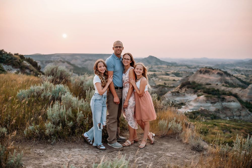 Family posed at Painted Canyon, Medora, ND - lifestyle family photographer serving southwest North Dakota
