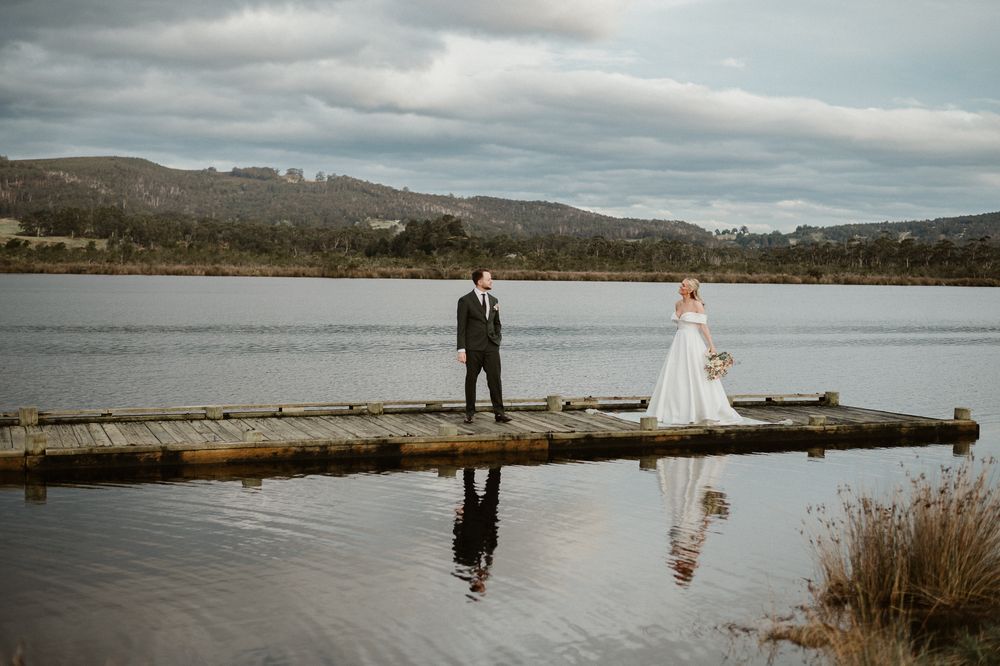 elopement in Franklin, Tasmania. Couple on a jetty. Captured by Joss Jensen Photography