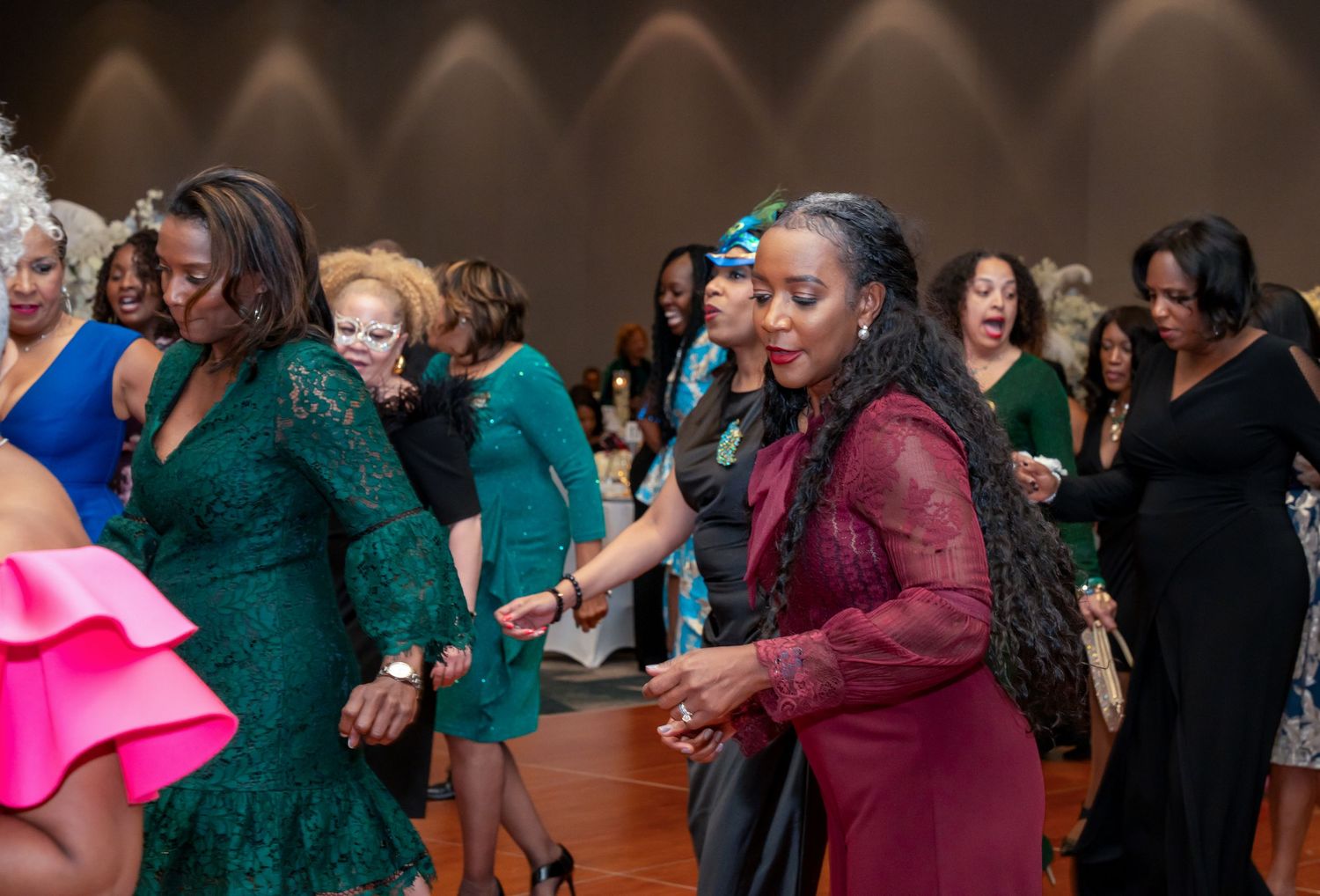 Candid shots of guests enjoying themselves at formal dinner celebration.