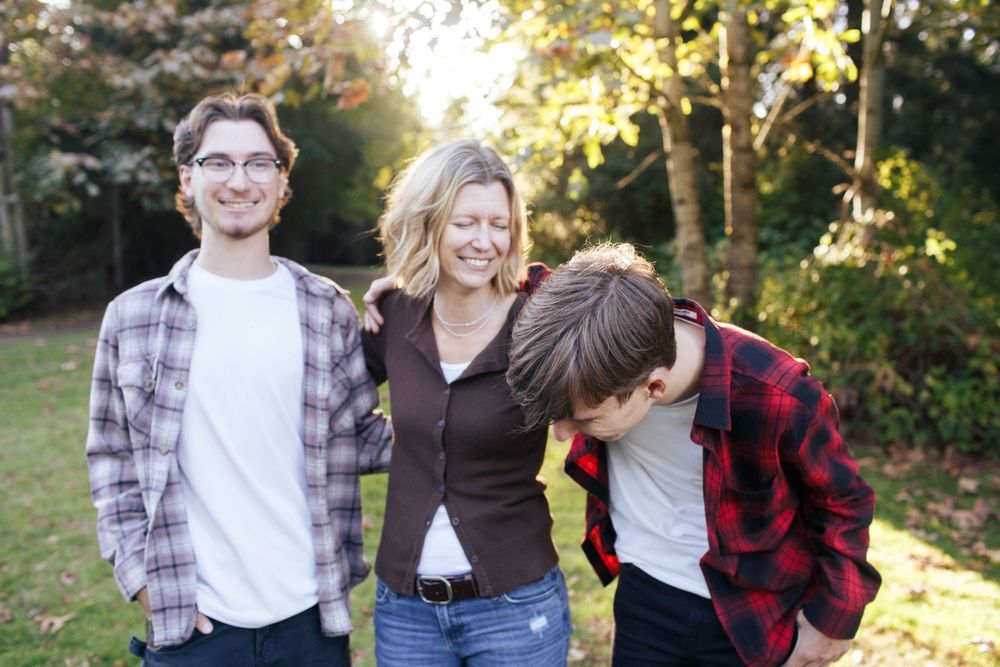 a mother with her teenage sons at a family session in Bothell North Creek Park- Everett family photographer