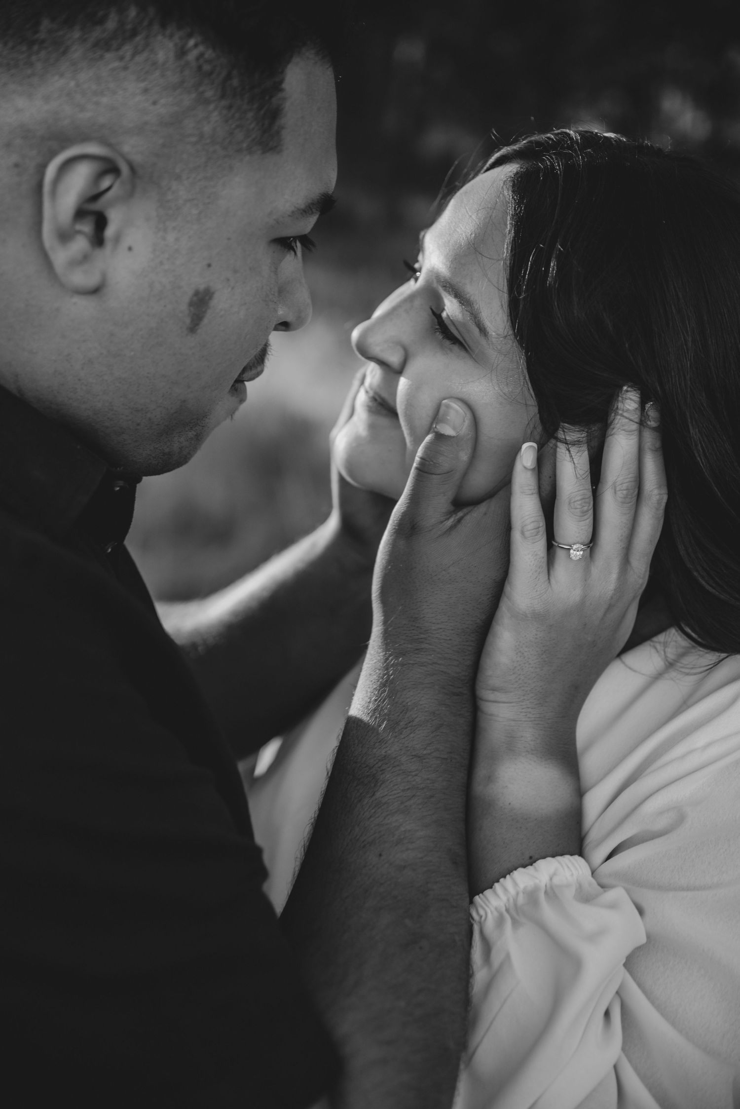 Intimate black and white close-up of tender moments between two people.
